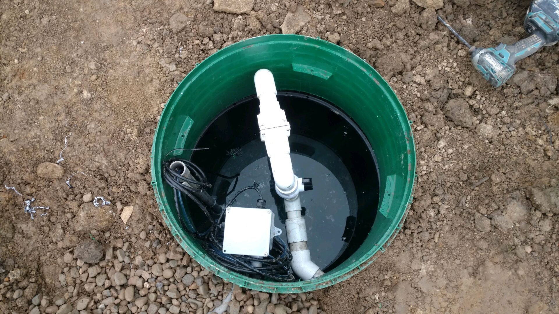 Opened pump station bulk head with white pipelines